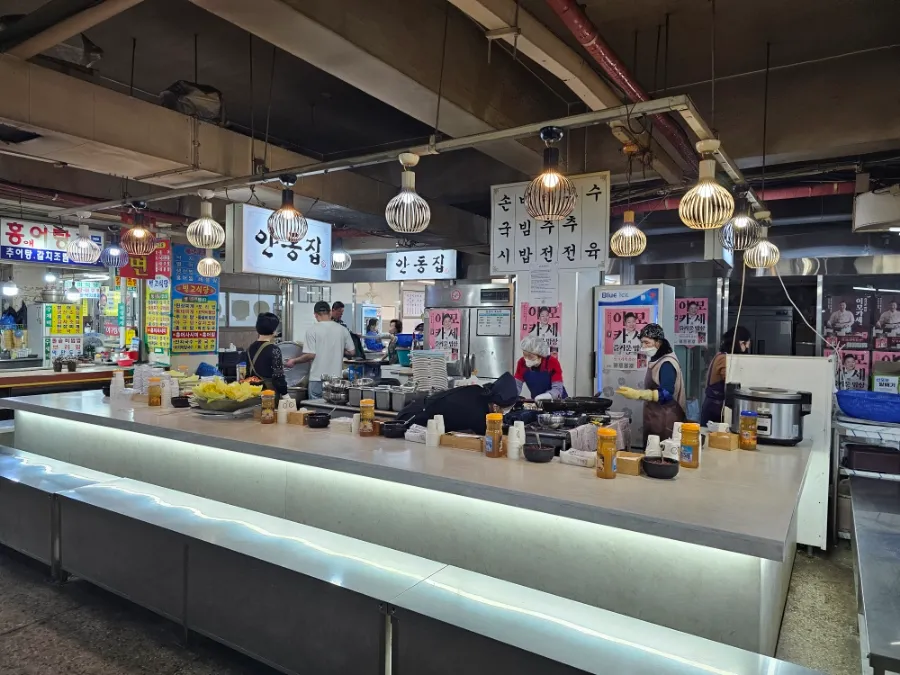 Counter seats and open kitchen at Andongjip in Gyeongdong Market