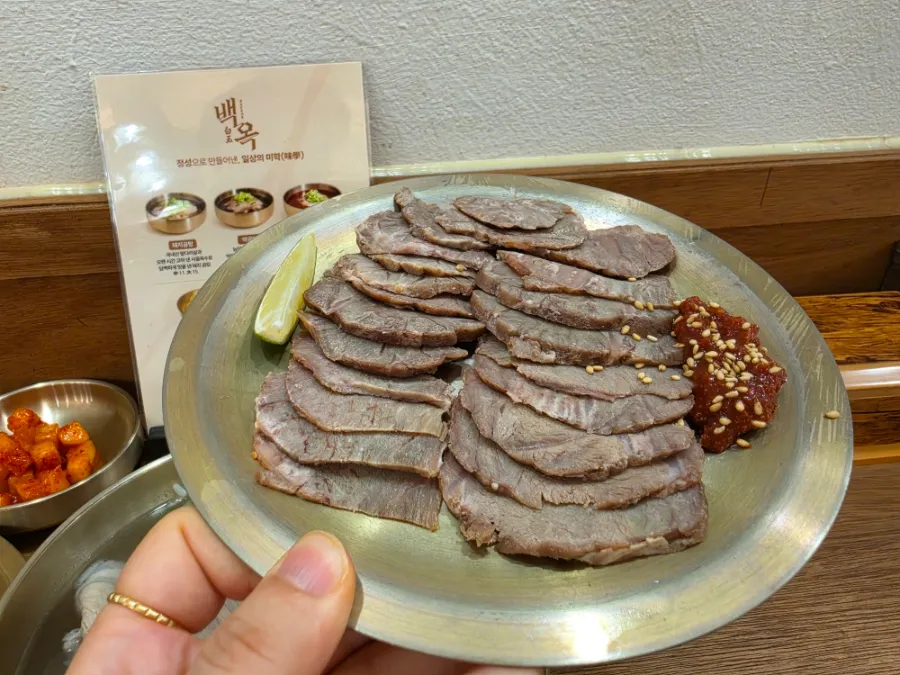 Korean cold pork slices with tohajeot and lime at Baekok Myeongdong