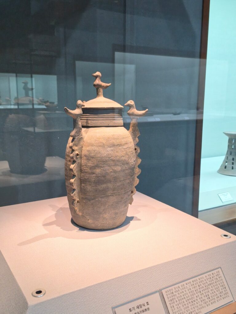Ancient earthenware jar decorated with small birds