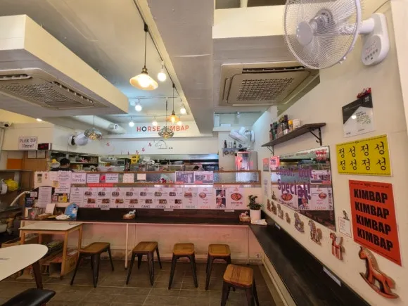 Interior and counter seats at Horse Kimbap in Seoul