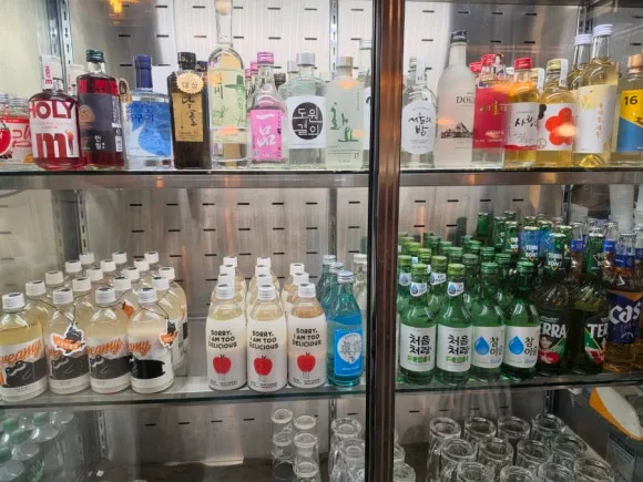 Korean makgeolli and alcoholic drinks displayed at Wooyirak