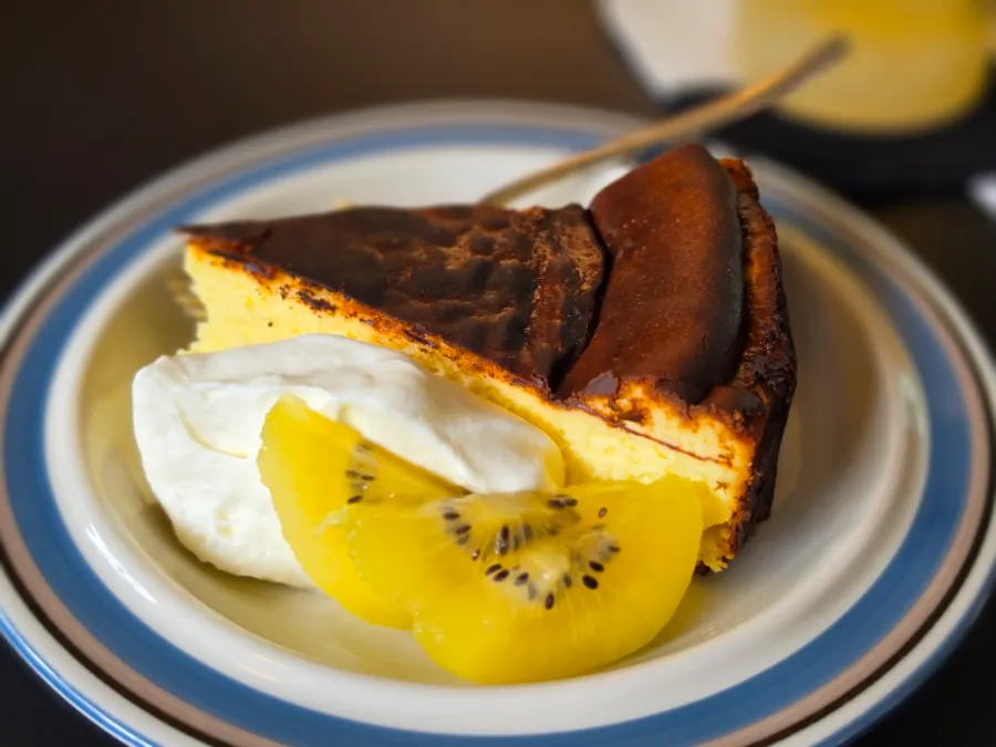 Basque cheesecake with cream and golden kiwi at Sideway cafe