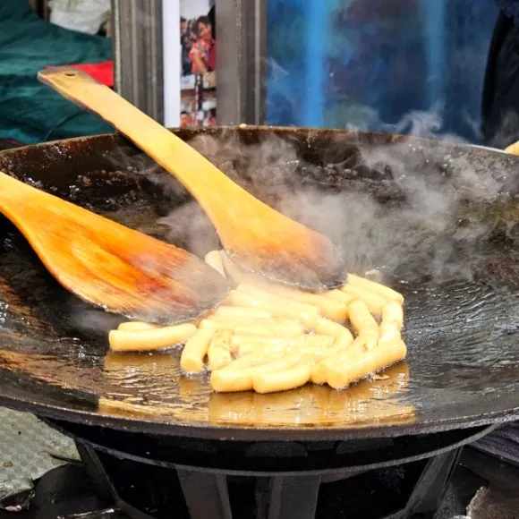 Gireum tteokbokki cooking on the griddle