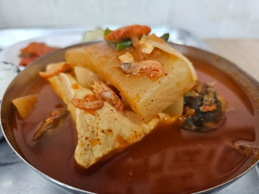 picy Korean pollock stew with radish, tofu, and seafood