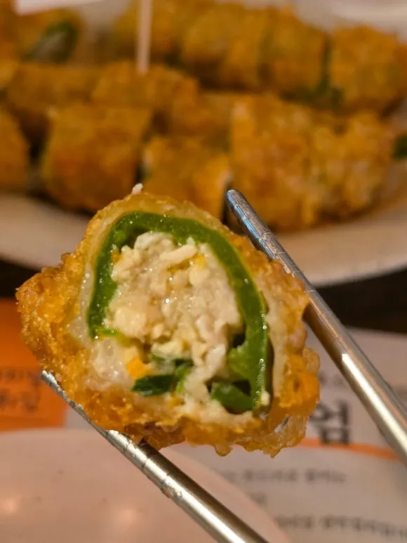 Inside a Korean fried chili pepper filled with minced meat and vegetables