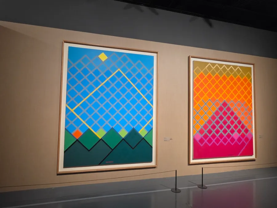 Two colorful geometric paintings by Yoo Youngkuk with intersecting diagonal lines