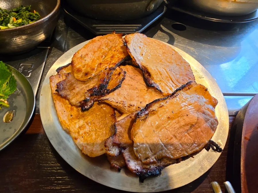 Korean pork grilled over coal briquettes at Eom Yong Baek