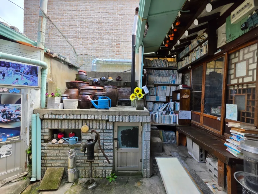 Daeo Bookstore courtyard with old books and Korean jars