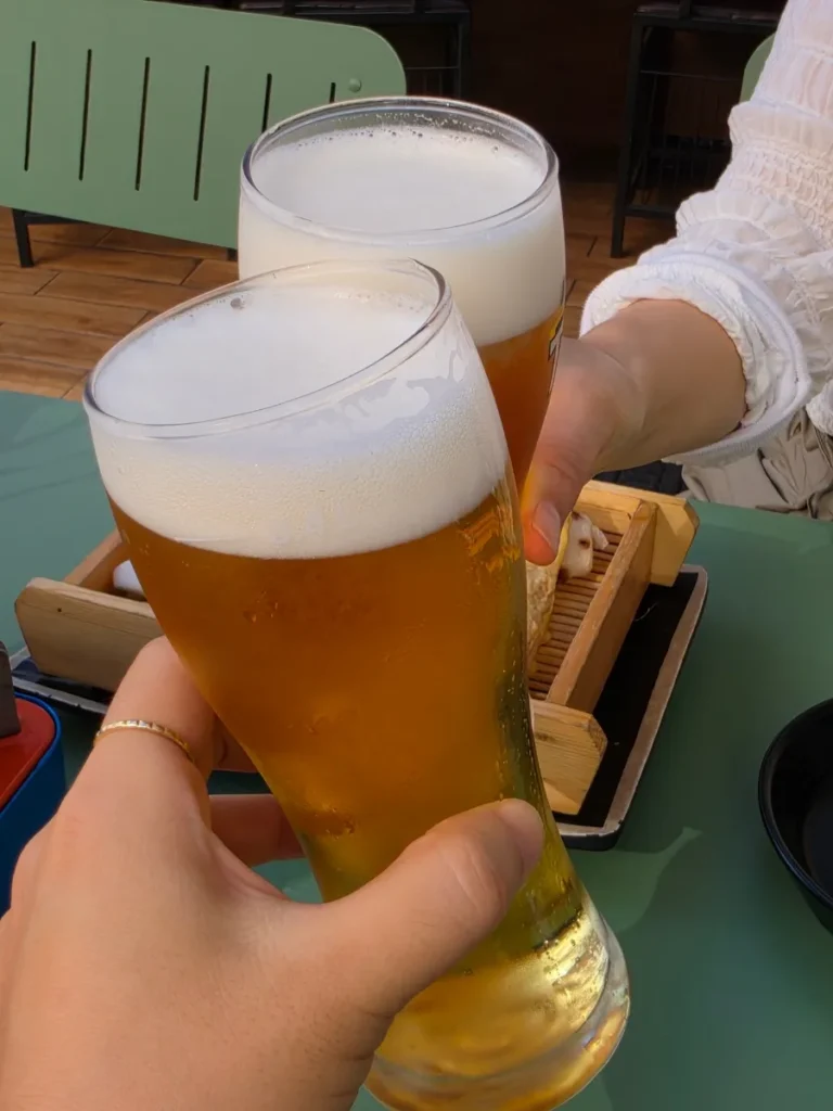 Two glasses of draft beer at Hanamato Daehangno Hyehwa in Seoul.