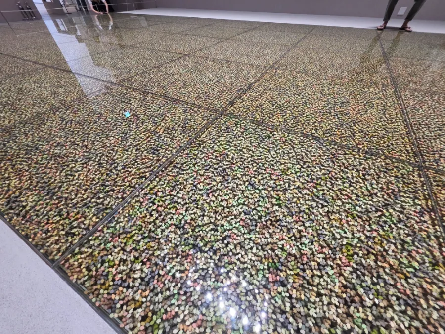 Floor installation with miniature figures by Do Ho Suh
