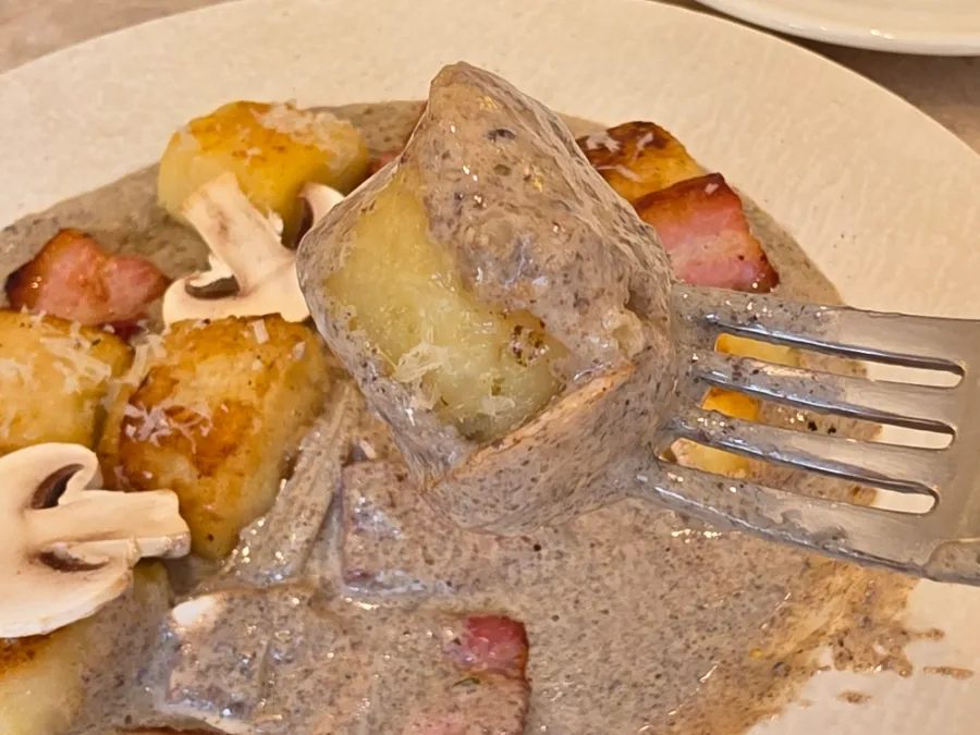 Soft potato gnocchi covered in truffle mushroom sauce