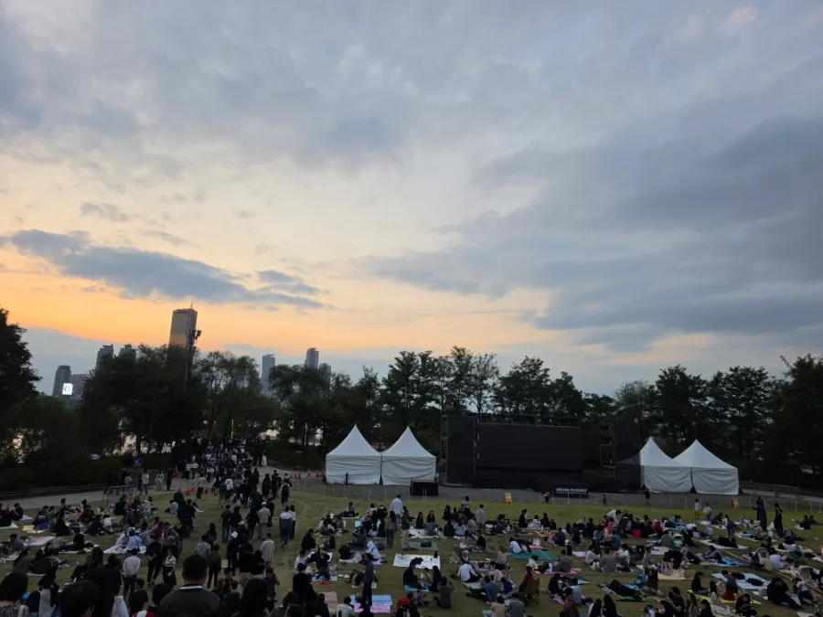 People enjoying a picnic on the lawn at Nodeul Island in Seoul
